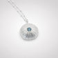 Natasha Wood Jewellery Sterling Silver Sea Urchin Pendant with Blue Topaz on curb chain - overhead flat lay