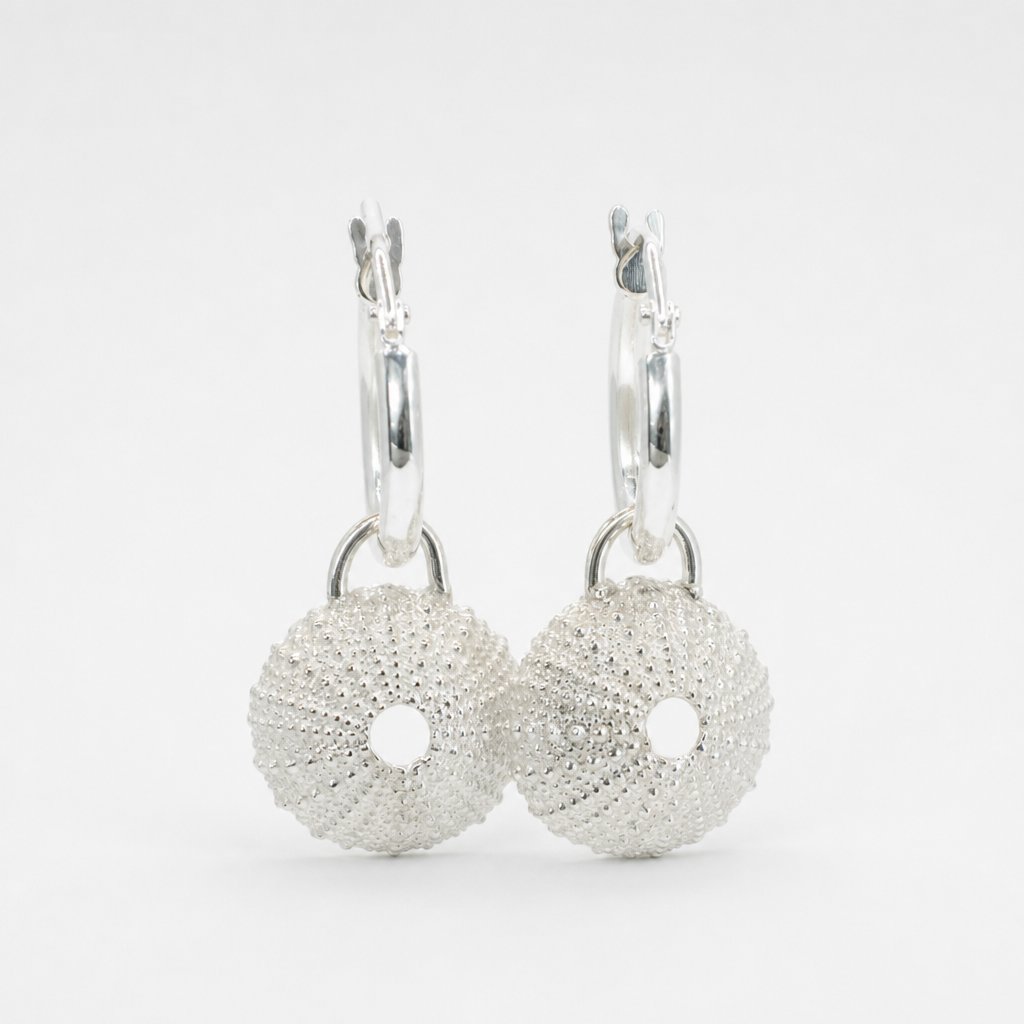 Silver Urchin Charm Hoop Earrings - front view textured sterling silver charms on display rod