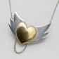 Brass Heart with Silver Wings Necklace - hero flat lay, mixed metal pendant on white background