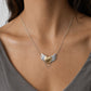 Brass Heart with Silver Wings Necklace - worn on model at collarbone, oxidised silver chain, handmade by Natasha Wood Jewellery