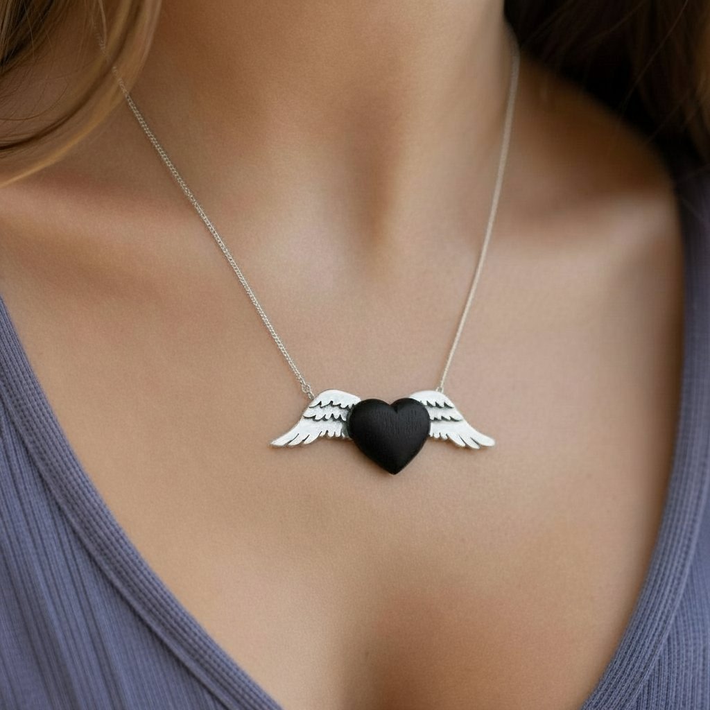 Silver Winged Wooden Heart Pendant – African Blackwood, front elevation showing sterling silver wing detail
