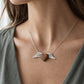 Silver Winged Wooden Heart Pendant – olive wood and sterling silver, angled view
