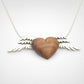 Silver Winged Wooden Heart Pendant – African Blackwood variant, angled studio shot
