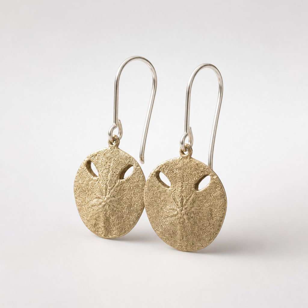 Small Pansy Shell Drop Earrings - brass variant front view on earring stand