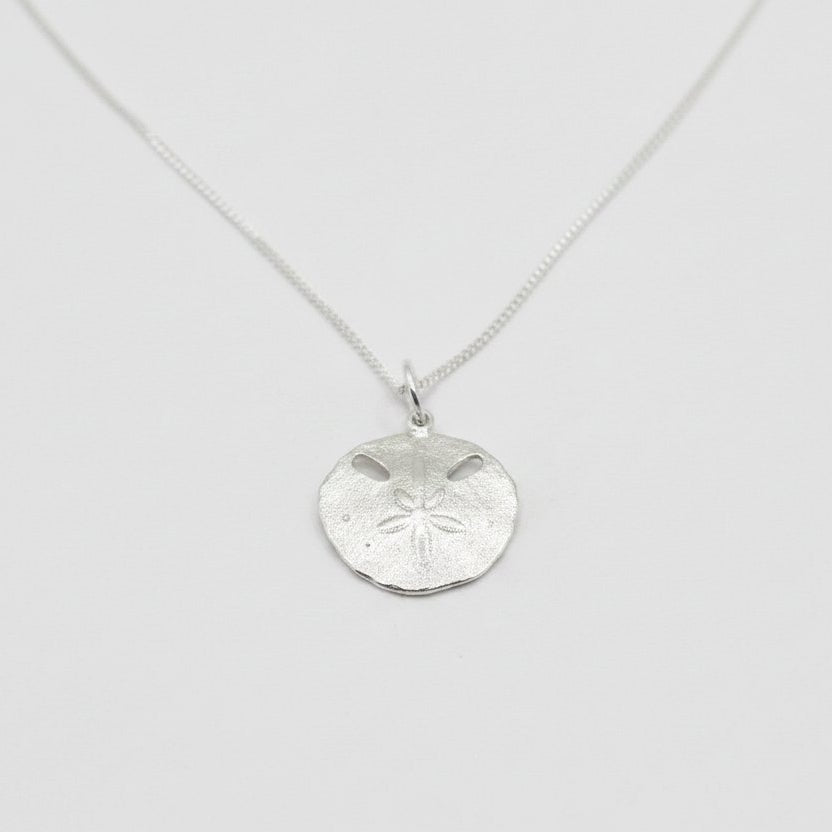 Small Pansy Shell Pendant - angled hero shot, solid sterling silver on curb chain