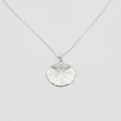Small Pansy Shell Pendant - angled hero shot, solid sterling silver on curb chain