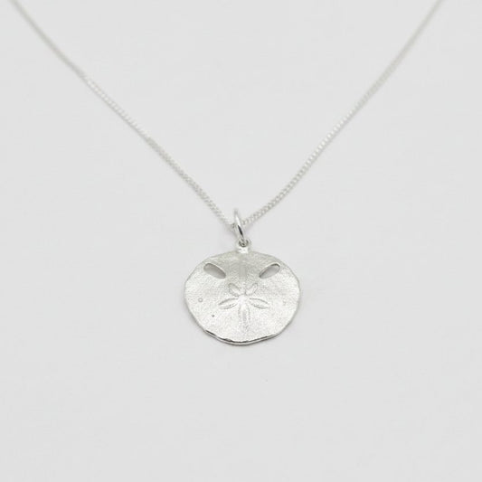 Small Pansy Shell Pendant - angled hero shot, solid sterling silver on curb chain