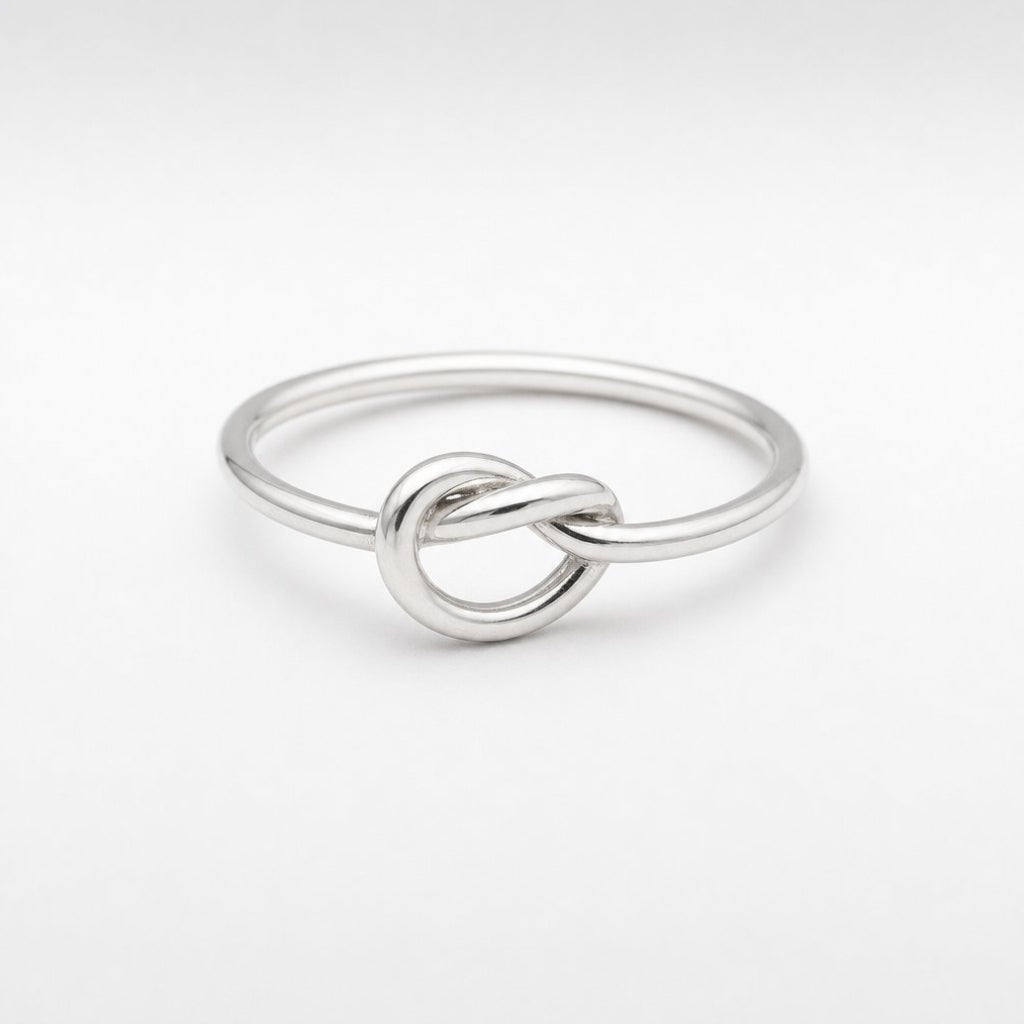 Sterling Silver Knot Ring - flat lay product shot, polished silver wire