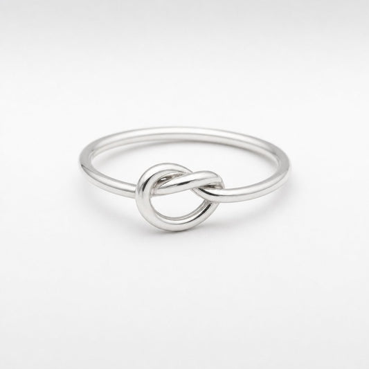 Sterling Silver Knot Ring - flat lay product shot, polished silver wire