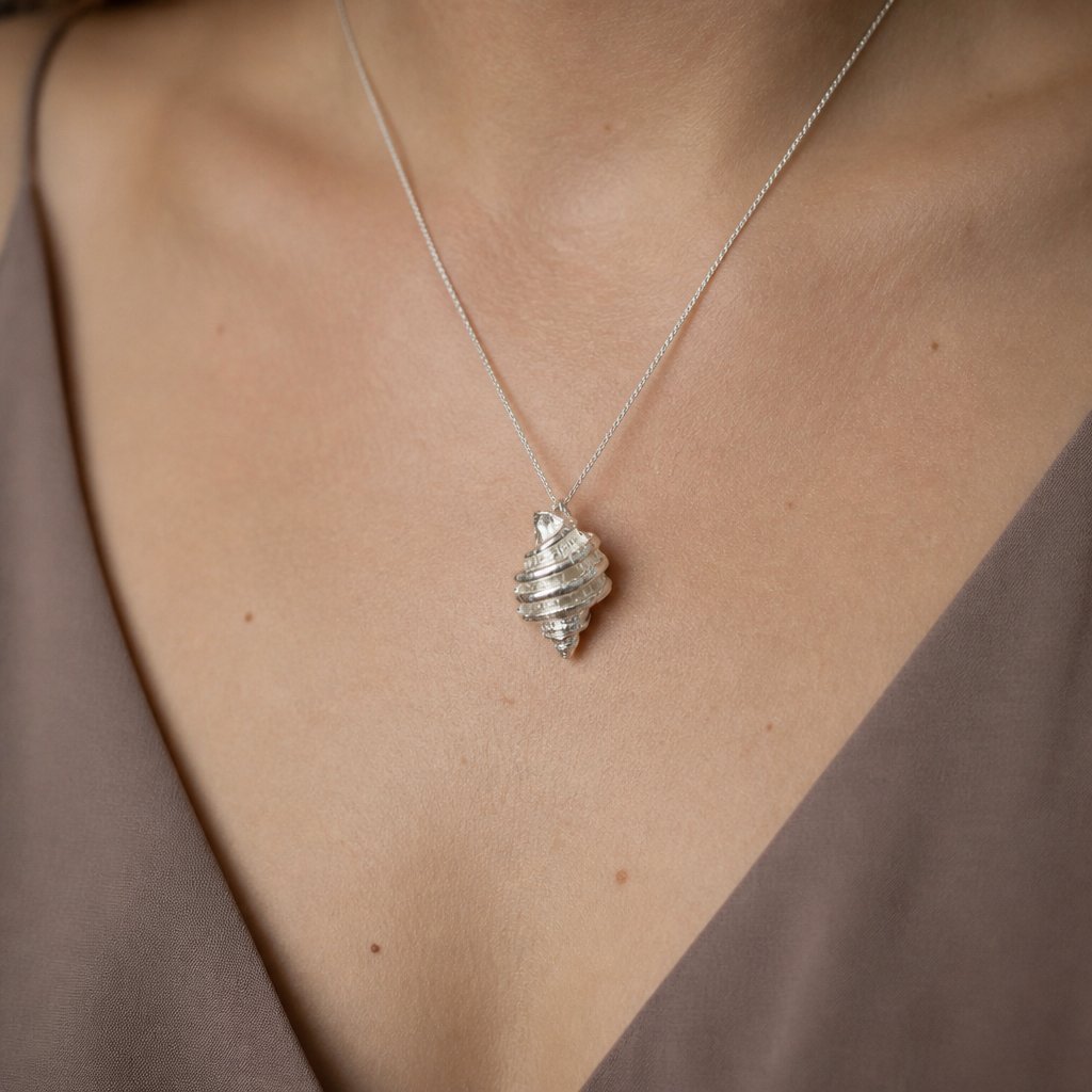 Tulip Conch Necklace - sterling silver tulip conch pendant hanging on white background front view