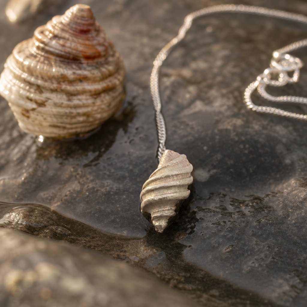Tulip Conch Necklace - brass variant pendant on sterling silver chain white background side view