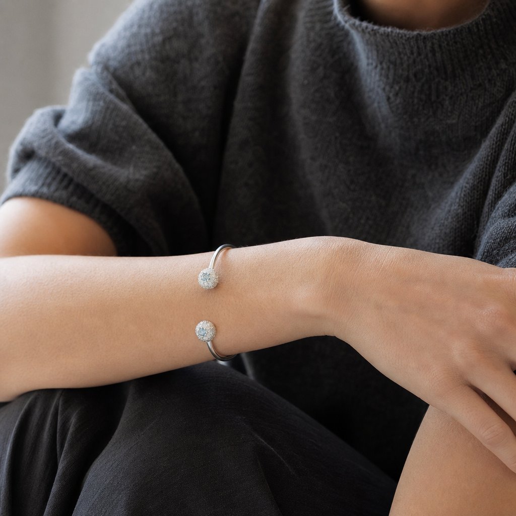 The Sea Urchin Bangle - three-quarter view sterling silver cuff with Blue Topaz gemstone detail