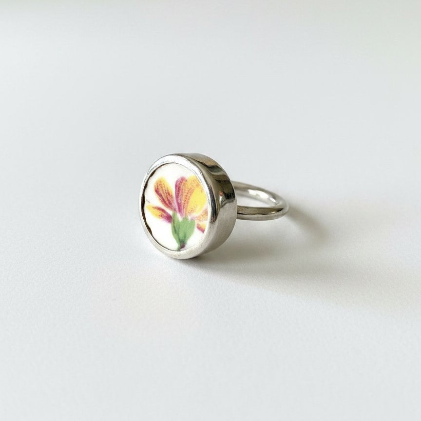 Yellow Flower Ceramic Ring - worn on hand showing scale, sterling silver band with antique ceramic centre