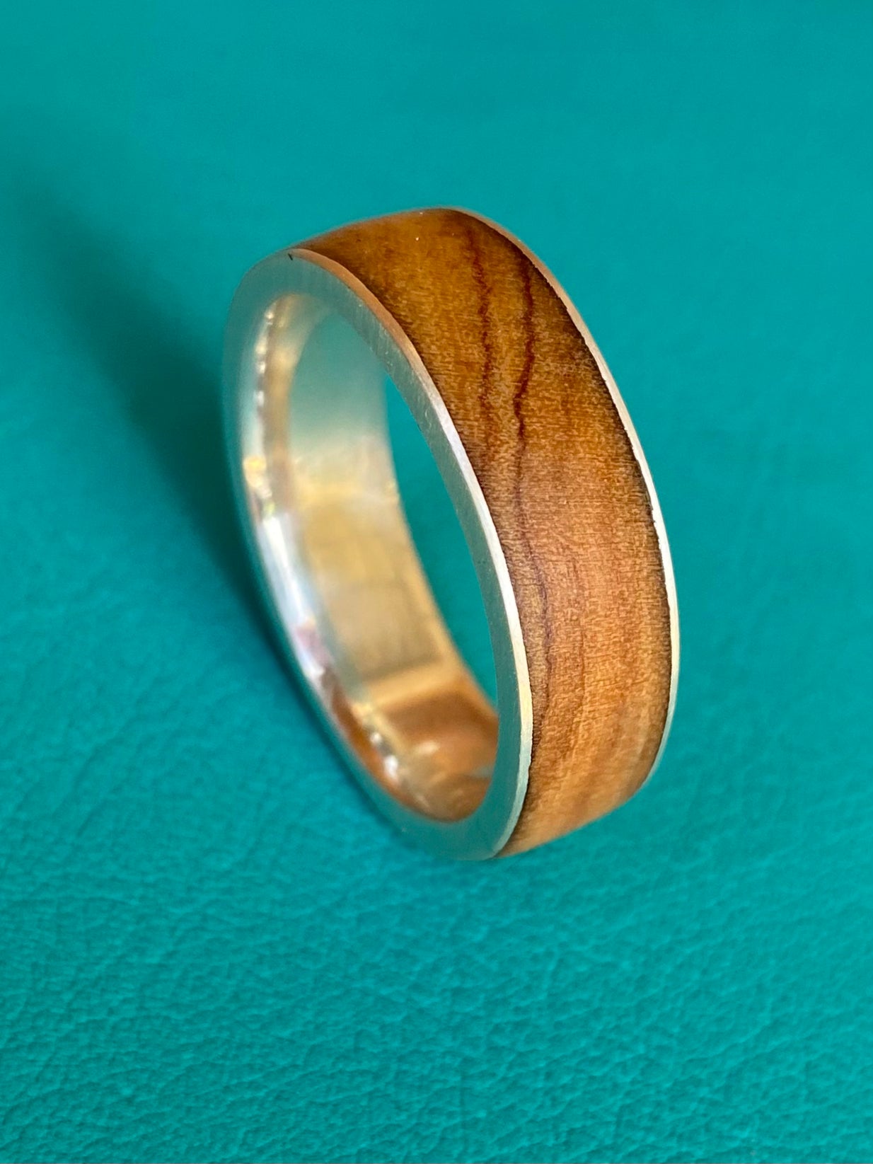 Olive wood with thin silver sides