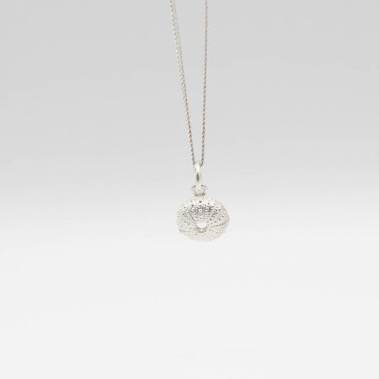 Small Sea Urchin Necklace - sterling silver sea urchin pendant on white gradient background, front view