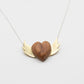 Olive Wood Heart Necklace with Brass Wings - front view flat lay, handcrafted by Natasha Wood Jewellery