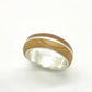 Close-up of the comfortable interior fit of the double-layer silver band with olive wood.