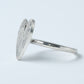 Protea Heart Ring - close-up on finger protea engraving brass